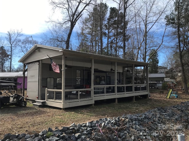 exterior space featuring a sunroom