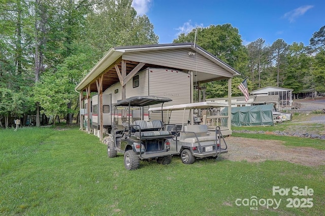 exterior space with a covered pool and a carport