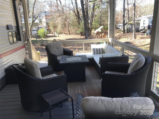 wooden deck with an outdoor living space