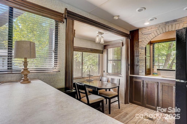 dining space with light wood finished floors