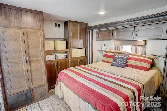 bedroom with light wood-style flooring