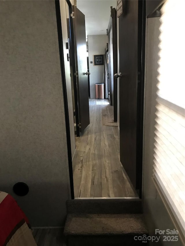 hallway featuring light wood finished floors