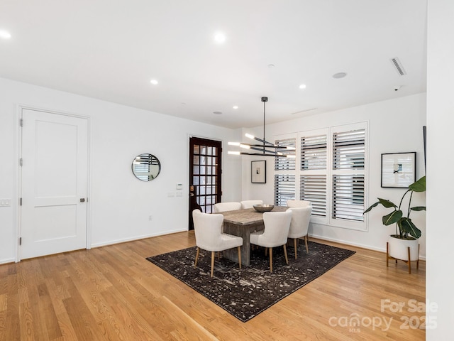 dining room featuring visible vents, a chandelier, wood finished floors, and recessed lighting