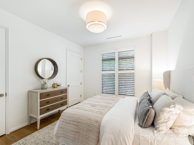 bedroom featuring wood finished floors