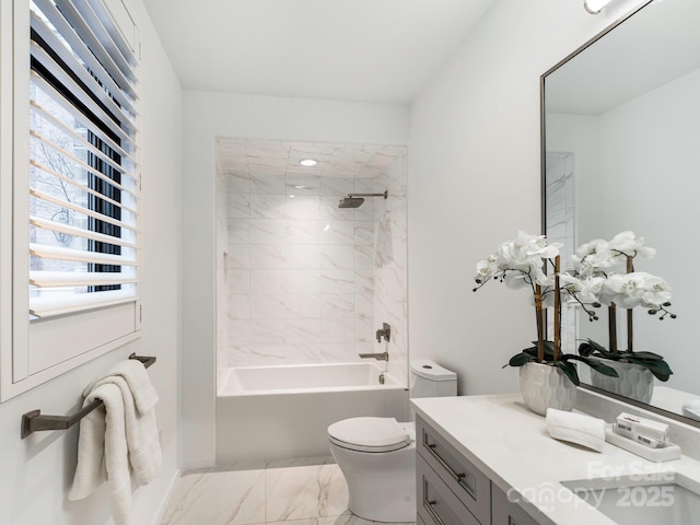 bathroom with marble finish floor, vanity, toilet, and shower / bathtub combination