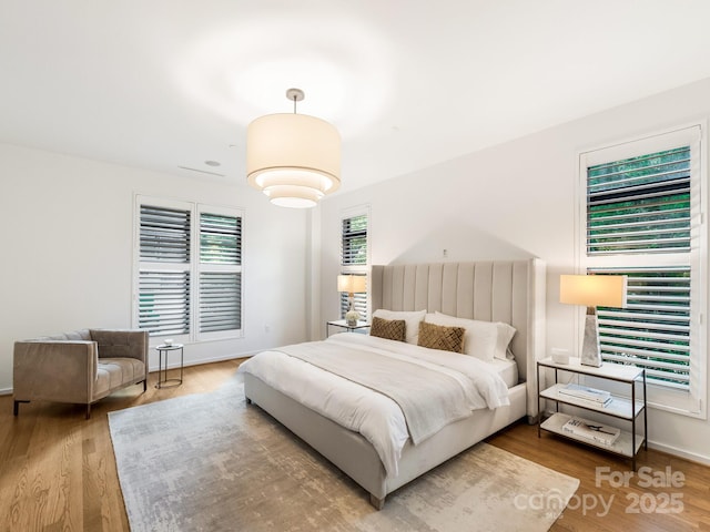 bedroom featuring wood finished floors