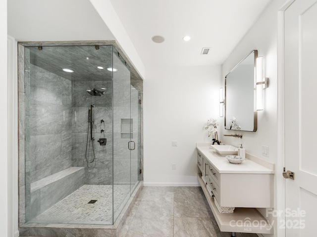 full bathroom featuring visible vents, baseboards, vanity, a shower stall, and recessed lighting