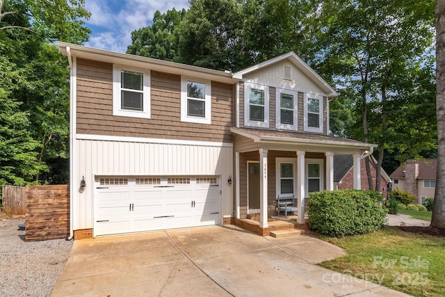 view of front of home with an attached garage, a porch, and concrete driveway