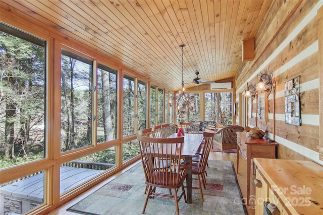 sunroom with lofted ceiling, plenty of natural light, wood ceiling, and a wall unit AC