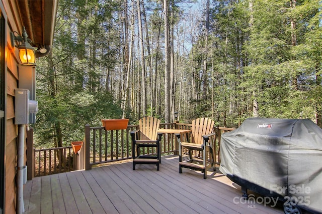 wooden deck with grilling area