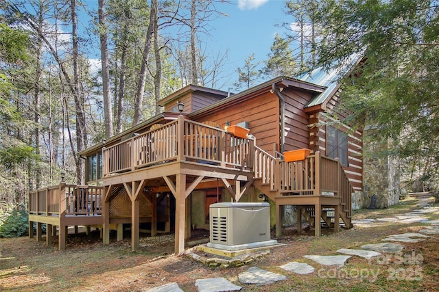 rear view of house with a deck and stairs