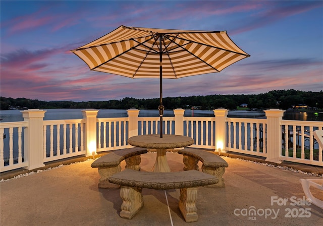 view of patio terrace at dusk