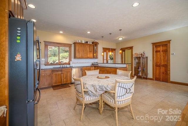 dining area featuring recessed lighting, baseboards, and light tile patterned floors