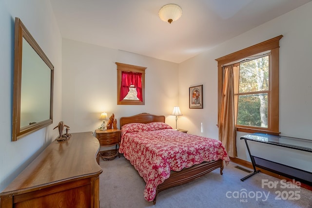 bedroom featuring carpet flooring and visible vents