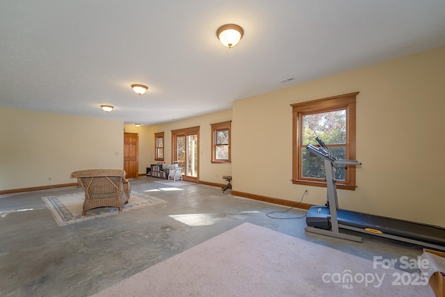 exercise room featuring visible vents and baseboards