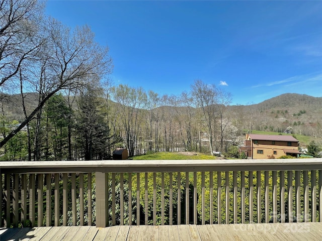 wooden terrace with a mountain view and a forest view