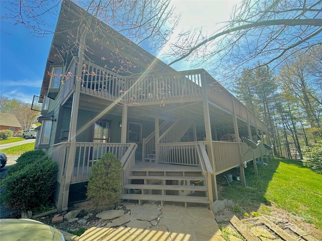 back of property with a porch