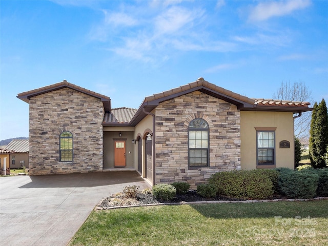 mediterranean / spanish-style house featuring stone siding, a tile roof, driveway, and stucco siding