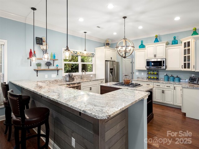 kitchen featuring light stone counters, appliances with stainless steel finishes, dark wood-type flooring, ornamental molding, and glass insert cabinets