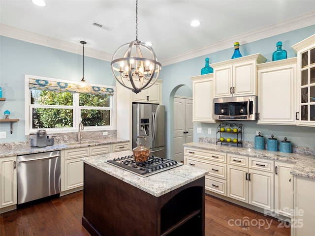 kitchen with visible vents, appliances with stainless steel finishes, open shelves, and ornamental molding