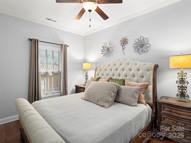 bedroom with baseboards, visible vents, a ceiling fan, ornamental molding, and wood finished floors