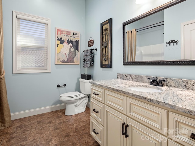 full bath featuring toilet, baseboards, and vanity