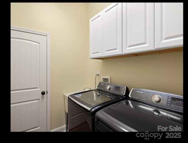 laundry room featuring cabinet space and washer and dryer