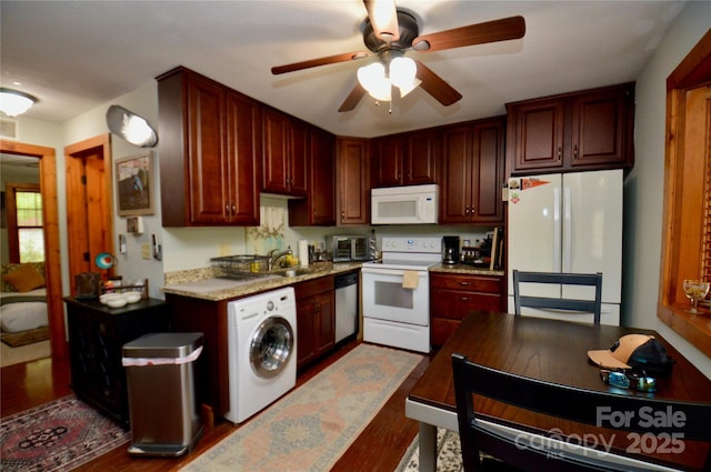 kitchen featuring reddish brown cabinets, washer / clothes dryer, light countertops, a ceiling fan, and white appliances