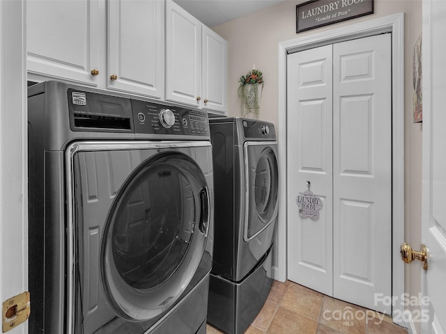 clothes washing area with cabinet space and washing machine and clothes dryer