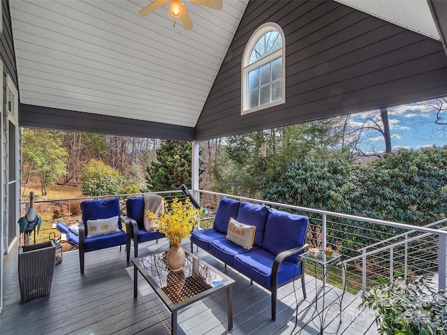 wooden terrace with ceiling fan and outdoor lounge area