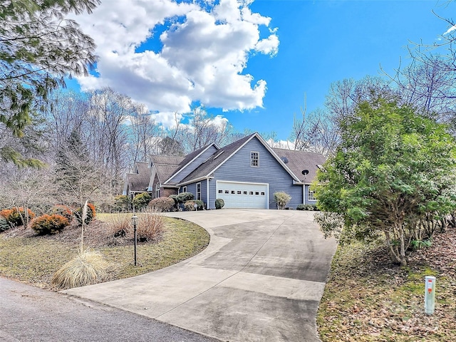 view of front of home with driveway and an attached garage