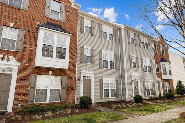 view of property with brick siding