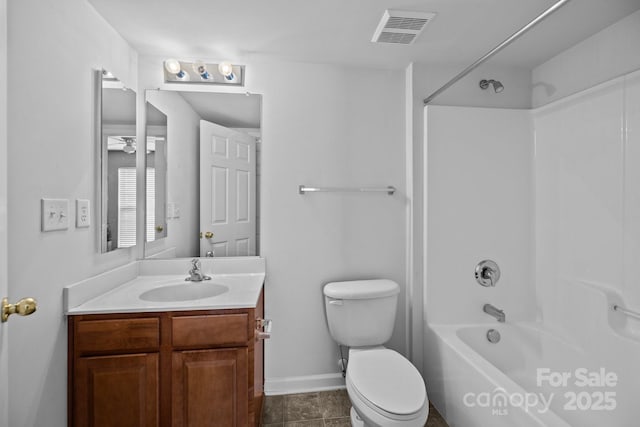 bathroom with toilet, vanity, visible vents, baseboards, and tub / shower combination