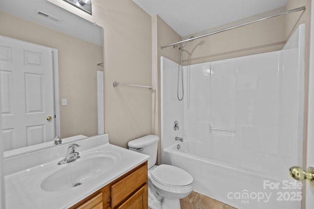 full bath with tile patterned flooring, toilet, visible vents, vanity, and tub / shower combination