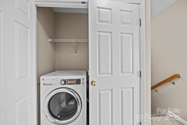 clothes washing area with laundry area and washer / clothes dryer