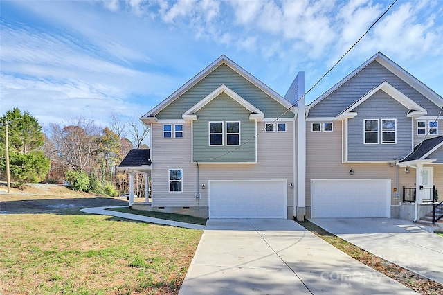 view of front of house with driveway, a garage, and a front yard