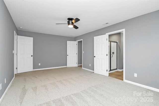 unfurnished bedroom with baseboards, visible vents, and carpet flooring