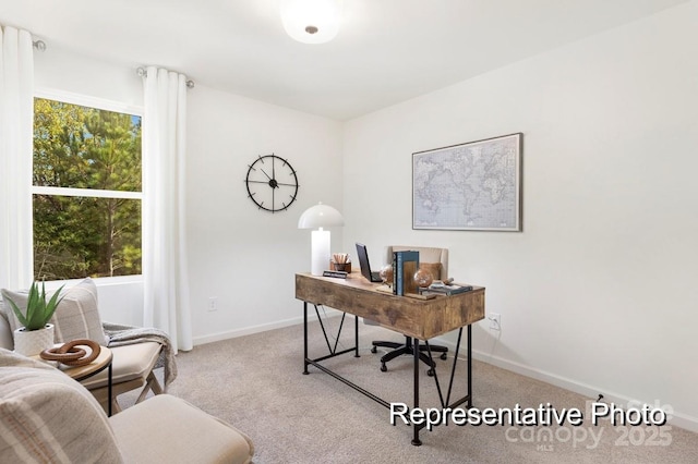 carpeted office space with baseboards