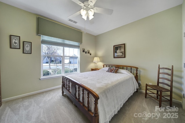 bedroom with baseboards, visible vents, ceiling fan, and carpet flooring