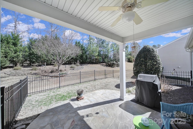 view of patio featuring a fenced backyard, grilling area, and a ceiling fan