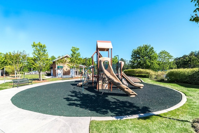 communal playground featuring a lawn