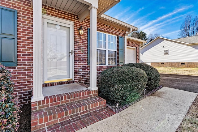 property entrance with brick siding