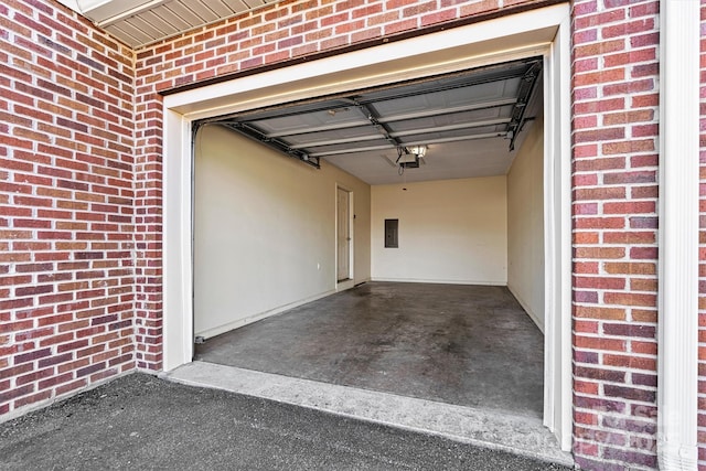 garage featuring a garage door opener and electric panel