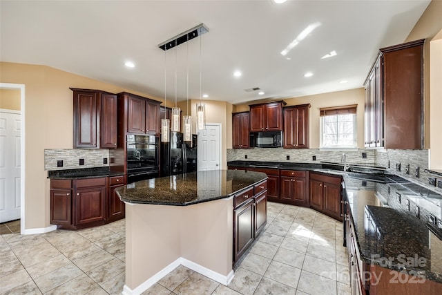 kitchen featuring black appliances, tasteful backsplash, a kitchen island, and pendant lighting