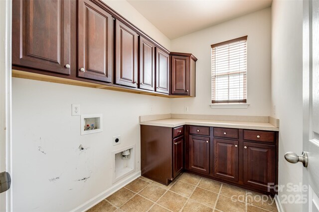 laundry room with hookup for a washing machine, cabinet space, and hookup for an electric dryer