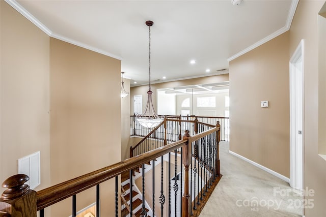 hall with visible vents, crown molding, an upstairs landing, and light colored carpet