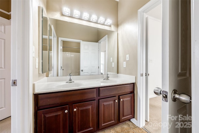 full bath featuring double vanity and a sink