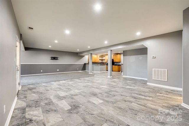 interior space with recessed lighting, visible vents, and baseboards