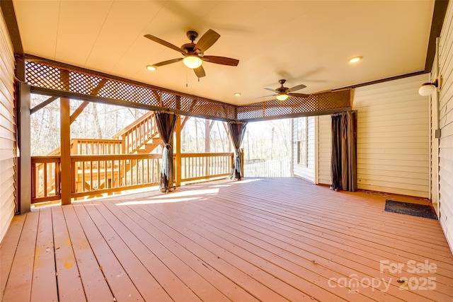 wooden deck featuring a ceiling fan