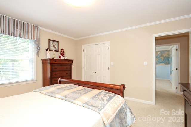 bedroom featuring light carpet, baseboards, crown molding, and a closet